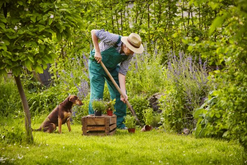 Gardener working safely in a Norwood Green garden