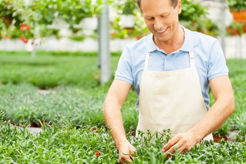 Gardeners reviewing a customer complaint with notes and documents